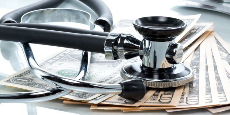 Dollar bills with stethoscope. Cost Of Healthcare Overseas