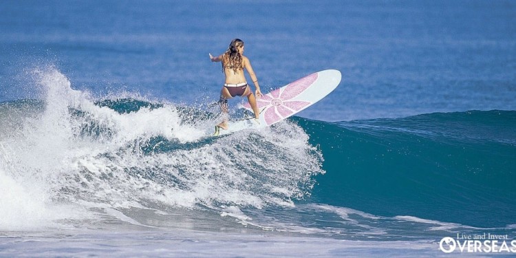 Surfer in Panama riding a wave break