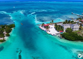 aerial view of the feep blue sea and colorful buildings on the coast of Belize
