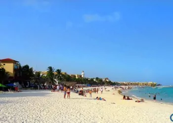People sunbathing and swimming in Playa del Carmen