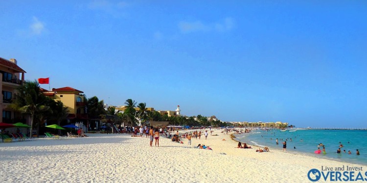People sunbathing and swimming in Playa del Carmen