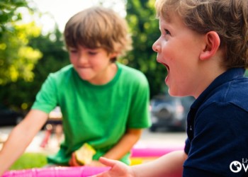 two boys playing outdoors