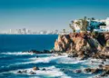 Mazatlan as seen from afar with a spectacular cliff line in the foreground