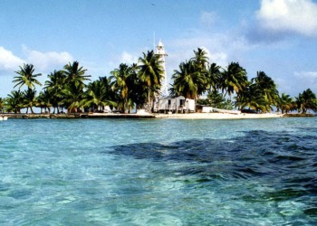 An island floating on crystal clear ocean water