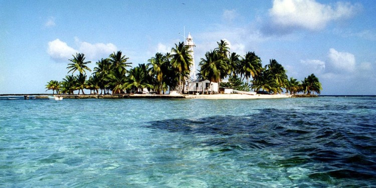 An island floating on crystal clear ocean water