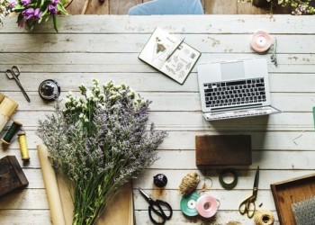 flowers on a desk at a flower shop as seen from above