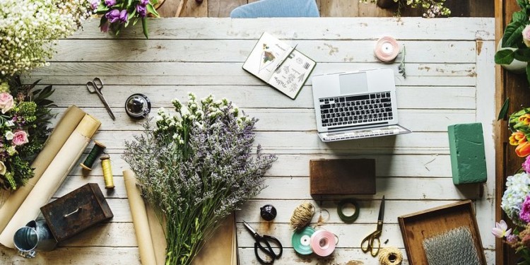flowers on a desk at a flower shop as seen from above