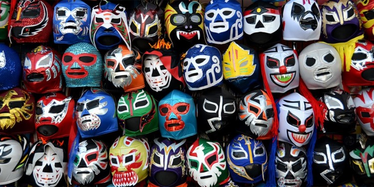 colorful mexican wreslter masks hanging on a wall