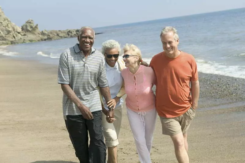 couples walking on the beach