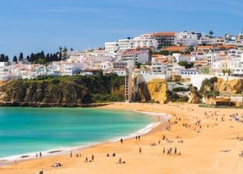 Portugal beach with yellow sand and blue seas during the summer