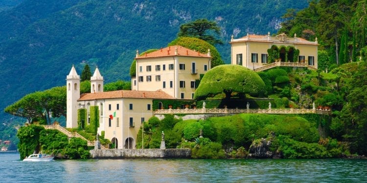 A view from the water of a lakeside Italian villa
