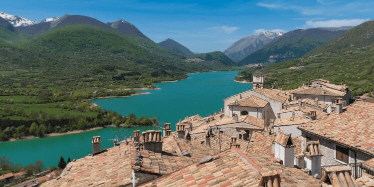 Abruzzo houses overlooking a lake and mountains