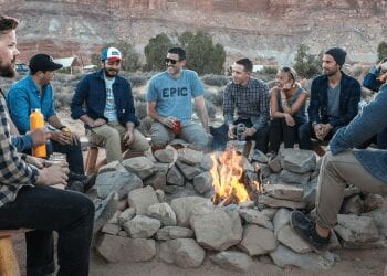 best countries for expats, people gathered arround a bonfire