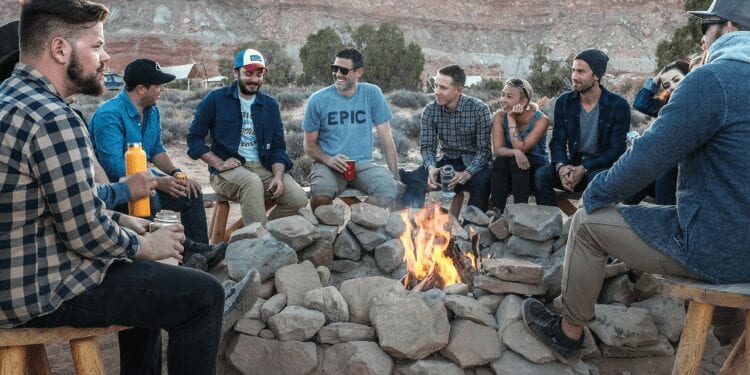 best countries for expats, people gathered arround a bonfire
