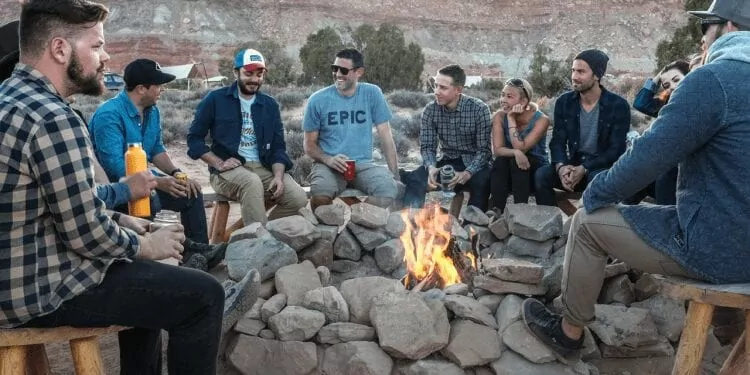 best countries for expats, people gathered arround a bonfire