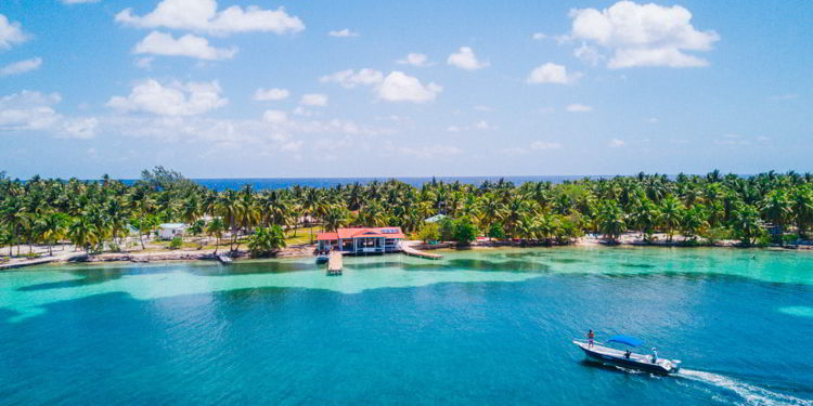 Aerial Drone view of South Water Caye tropical island in Belize barrier reef.