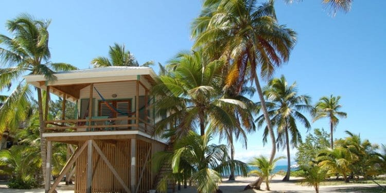a beach side house in belize on stilts