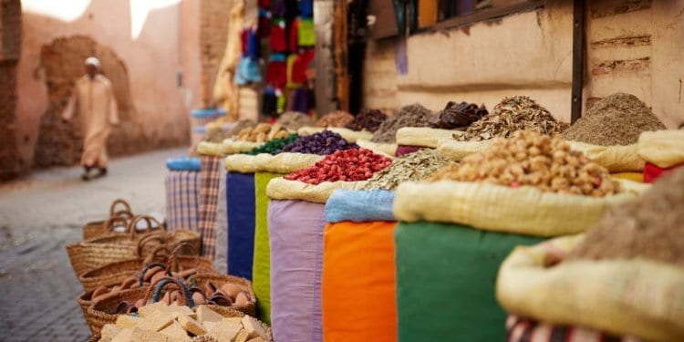 A spice vendor near his spices in Marrakech