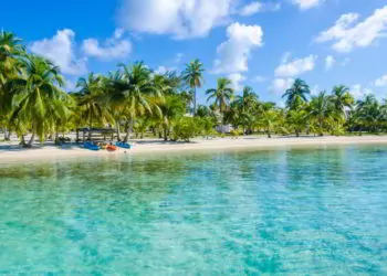 Small tropical island at Barrier Reef with paradise beach in Belize. barefoot paradise