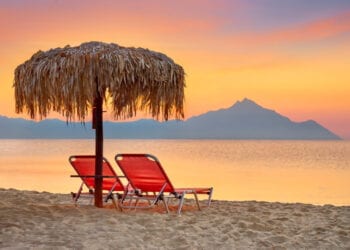 Halkidiki beach before sunrise, Mount Athos in the background, Greece.