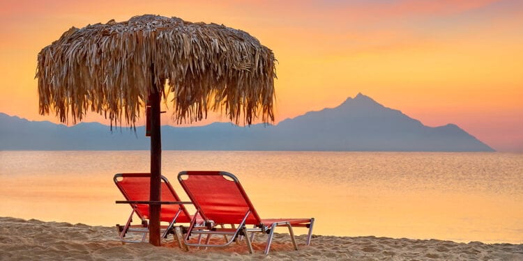 Halkidiki beach before sunrise, Mount Athos in the background, Greece.