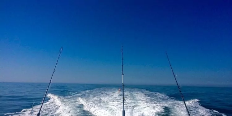 Offshore fishing boat with three rods