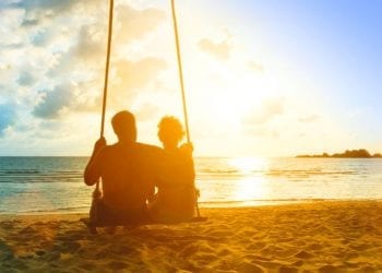 couple on a beach at sunset