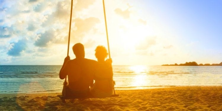 couple on a beach at sunset
