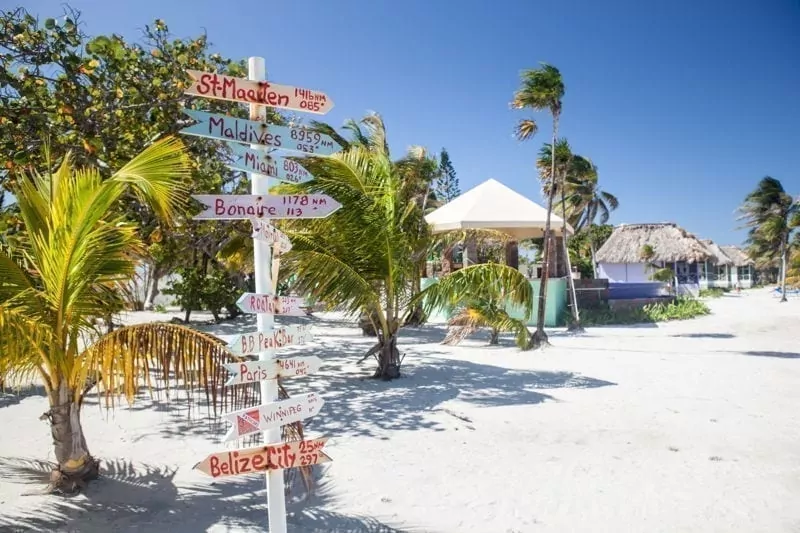 signpost on the beach in belize