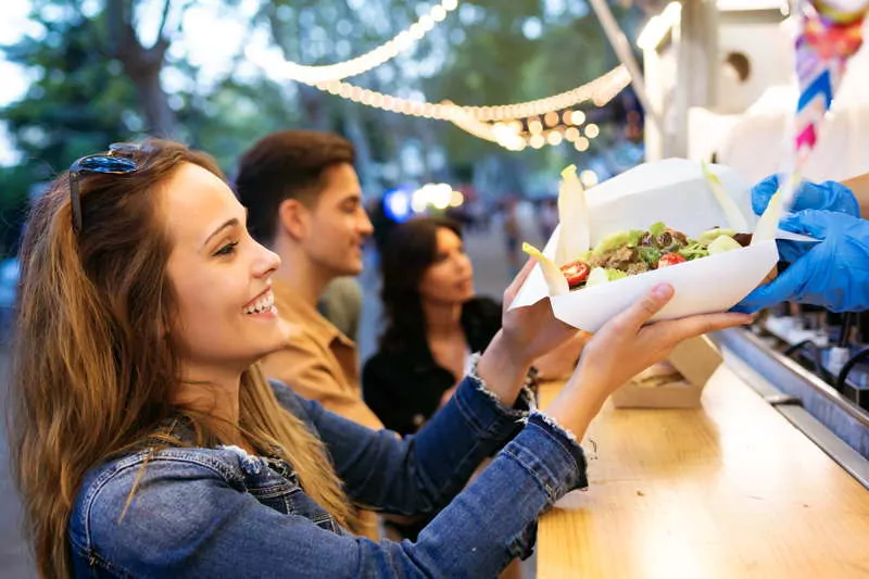 friends getting food from food truck