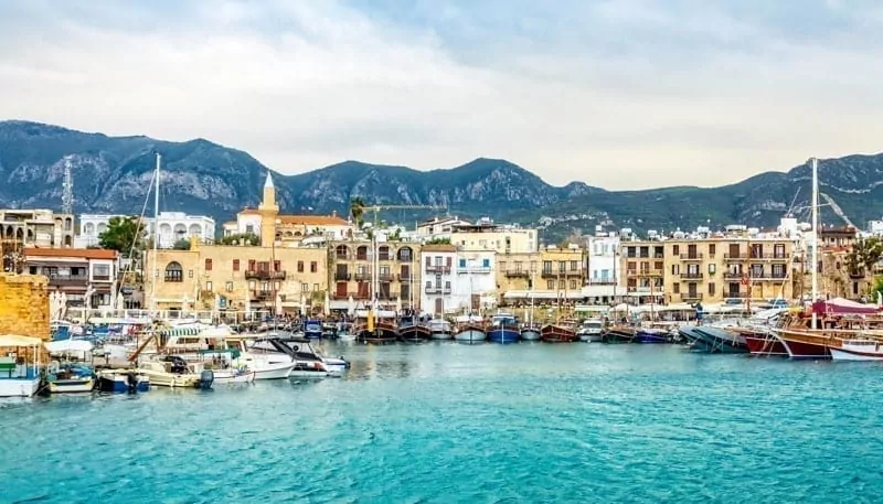 Kirenia historical city center, view to marina with many yachts and boats and mountains in the background, North Cyprus.