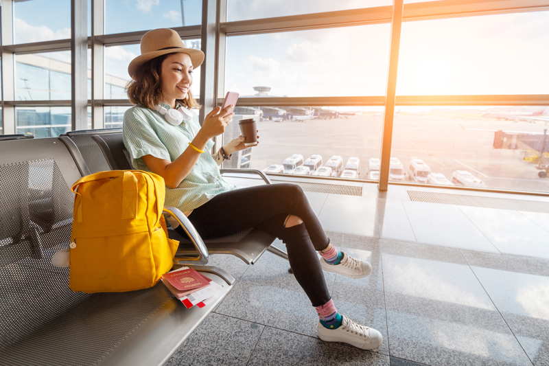 woman waiting at airport lounge