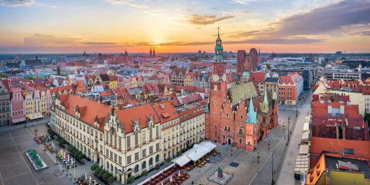 Aerial view of Rynek square, Poland with historic gothic Town Hall on sunrise.