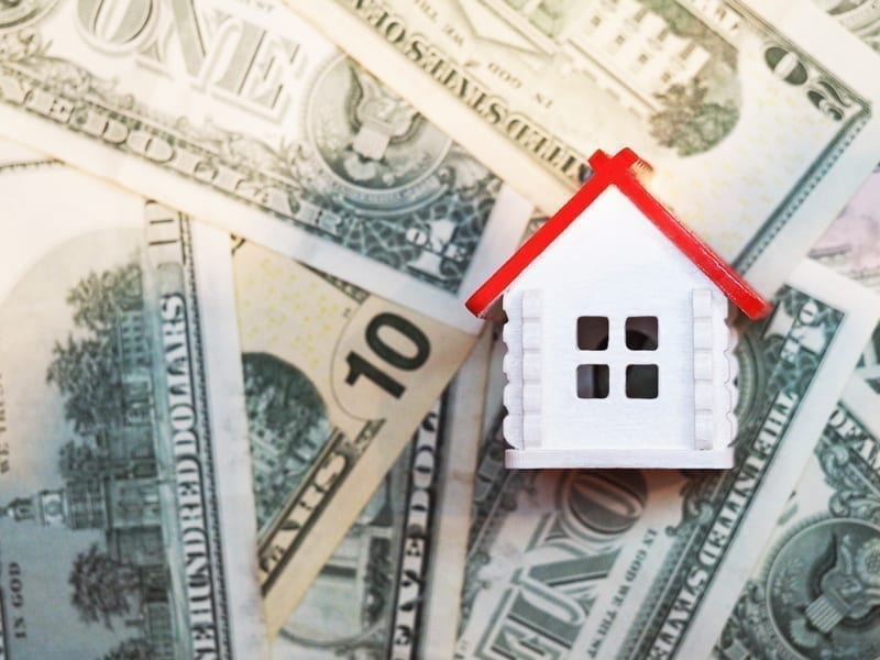 Home on top of U.S dollars. Resell property overseas concept.