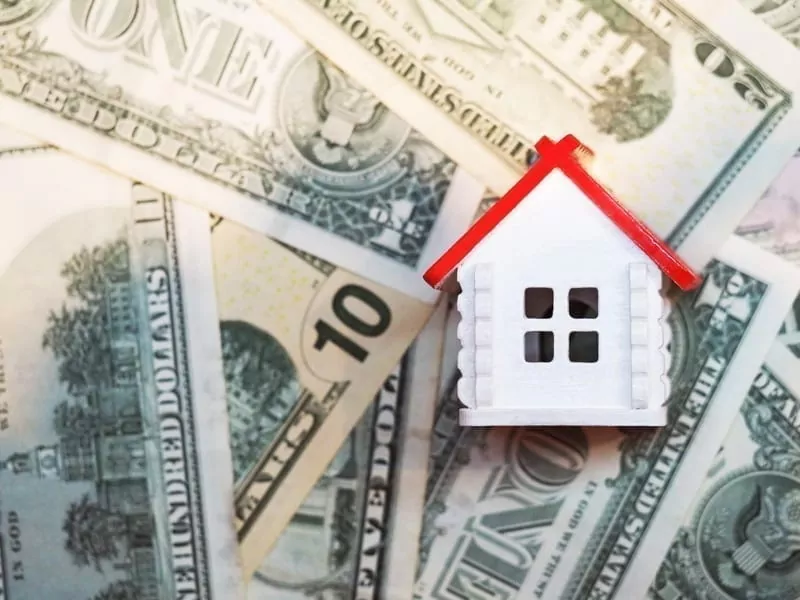 Home on top of U.S dollars. Resell property overseas concept.