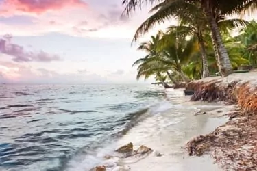 Beautiful tranquil beach sun rise in southern Belize.