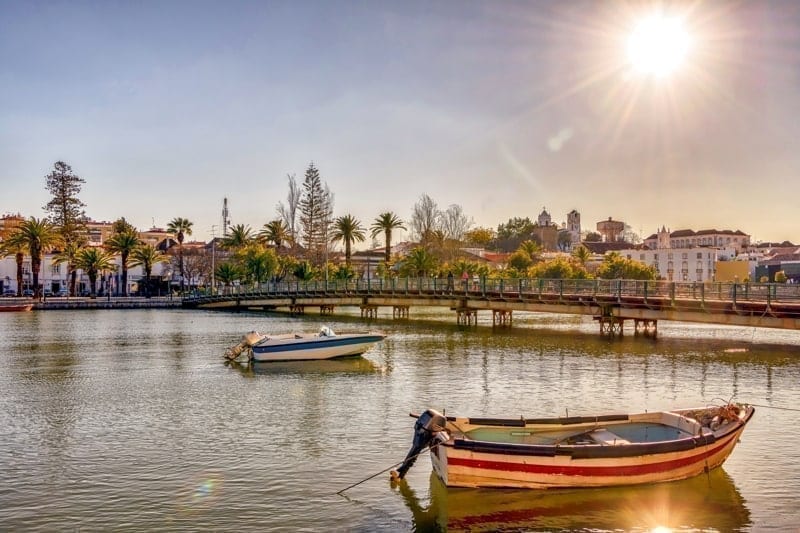 Colorful boats on the Gilao River in picturesque Tavira, Portugal