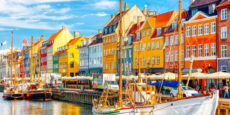 Famous old Nyhavn port in the center of Copenhagen, Denmark during summer sunny day