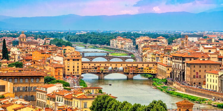 Panoramic view of medieval stone bridge Ponte Vecchio over Arno river in Florence, Tuscany, Italy