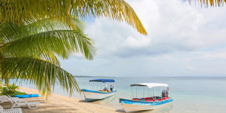 Boats at the Starfish beach, archipelago Bocas del Toro, Panama