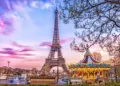 The Eiffel Tower and vintage carousel on a winter evening in Paris, France
