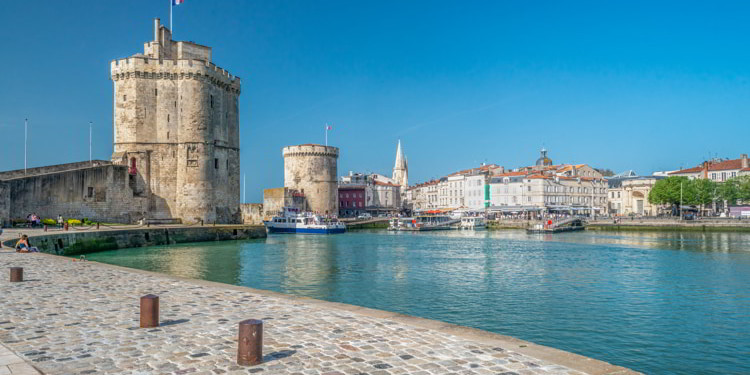 Two medieval towers at La Rochelle harbor in France