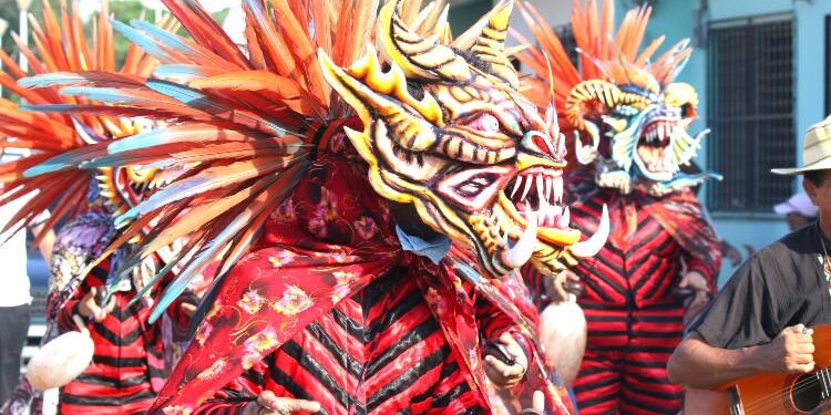 Diablicos dancing in the street in a Corpus Christi celebration. Panama