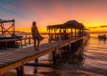 sunset on a pier, on Roatan Island. Honduras