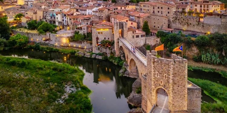 View Of The Medieval Bridge Of The Besalu, Catalonia, Spain. good life