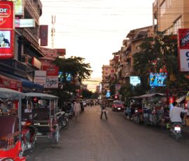 Motorcycle rickshaws line the streets of Phnom Penh, Cambodia.