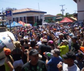 Revelers being sprayed by a water truck during carnival in Las Tablas, Panama.