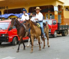 Cowboys ride through the streets of Las Tablas, Panama.
