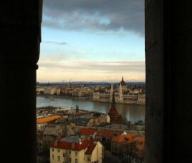 looking out a window onto budapest